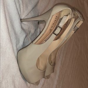 High heel pumps , cream . Size 10